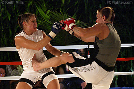 BodogFight (Aug 22, 2006): Amanda Buckner (right) kicking Tara LaRosa - Photo by Keith Mills