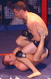 Kavanagh (top) sets up a leg lock