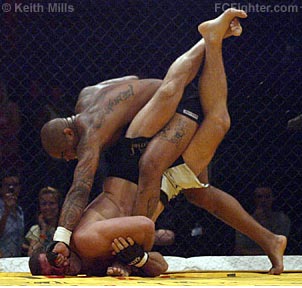 Yvel punching out of submission attempt by Scherner