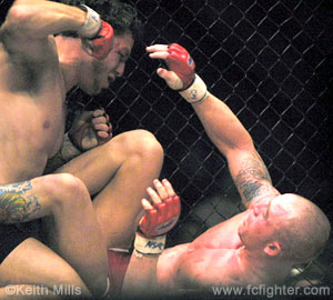 Black punching down on Chad Saunders at WFA 3
