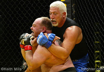 Larry Landless begins choke on Tony Berg