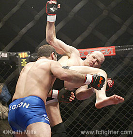 Dave Strasser throwing a kick, which led to him being taken down