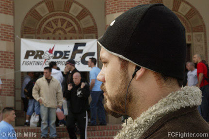 Cesar Gracie's Tim McKenzie trying to stay focused at 9 AM.  In the background is Chris Brennan and Adam Lynn descending the stairs under the banner.