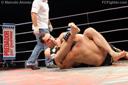 Predador FC (Aug 11, 2006): Marcio Corletta locking up a triangle choke on Silvio Santos for the win - Photo by Marcelo Alonso