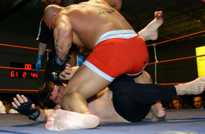 Jon McCaffrey taps out in the midst of a barrage of Jordan Pergola's punches