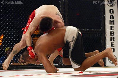 Rumble on the Rock 8 (Jan 2006): Carlos Condit (top) on his way to a victory over Renato Verissimo - Photo by Keith Mills