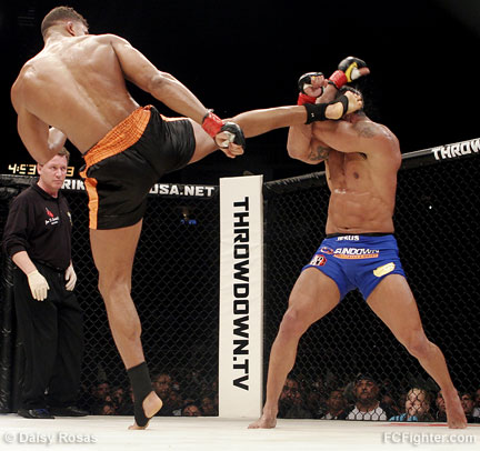 Overeem throwing a kick at Belfort