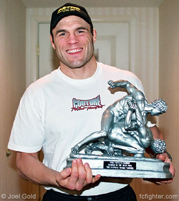 http://www.fcfighter.com/PICTURES/UFC46/couture-2003foty-trophy.jpg