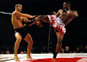 Paul Daley (right kicks Daniel Weichel