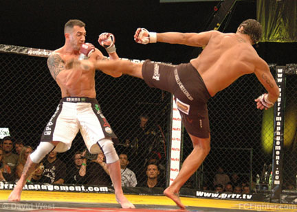 Cage Rage 21: Vitor Belfort (right) kicking Ivan Serati - Photo by David West