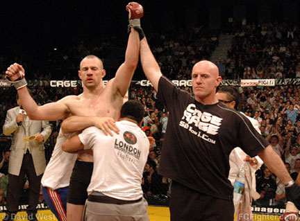 Cage Rage 21: Grant Waterman (R) raises James Zikic's hand in victory - Photo by David West