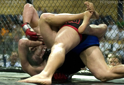 Extreme Challenge 81: Tim Boetsch (bottom) chokes Brendan Barrett into submission - Photo by Tom DeFazio