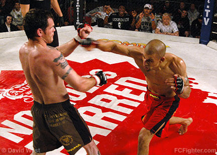 FX3 Fight Night 5: Andre Winner (right) launching a punch at Aidan Marron - Photo by David West 
