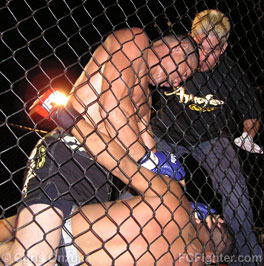 Garden Island Cage Match 5: Pauly Kawamura punching Julio Moreno - Photo by Chris Onzuka