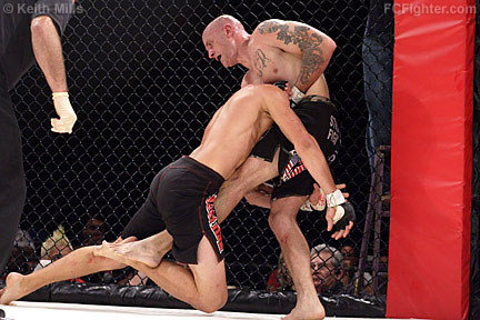 Panther Fight League "Genesis": Roger Krahl starts guillotine as Jeremy May shoots in - Photo by Keith Mills