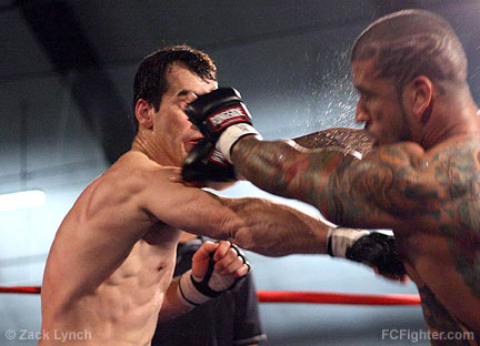 Reality Fighting Dominion: Belleton Frederic lands a solid punch on Rigo Dominicci - Photo by Zack Lynch