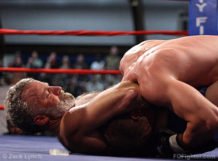 Reality Fighting Dominion: First-time fighter Dennis Siggins sinks in a solid guillotine on Jessie Reidhaar to win in Round 2 - Photo by Zack Lynch