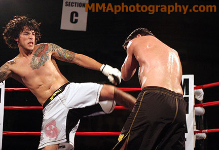 Reality Fighting New hapshire (June 2006): Kevin Roddy kicking Darryl MacAurele - Photo by Zack Lynch (MMAPhotography.com)