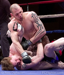 Ring of Combat 13: George Sullivan pounding out a win via TKO over Dave Porter - Photo by Tom DeFazio