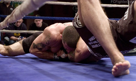 Ring of Combat 16: Mike Massenzio finishing off Erik Charles with a choke from North-South position - Photo by Tom DeFazio