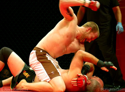 Total Fight Challenge 8: Brandon Munson pounding on Jeremy Morrison - Photo by Riley Kerestes