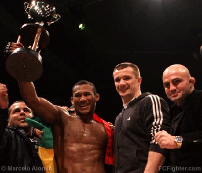 Jungle Fight Europe: Ronaldo Jacare is awarded the trophy by Mirko 'Cro Cop' Filipovic with JF promoter Wallid Ismail - Photo by Marcelo Alonso