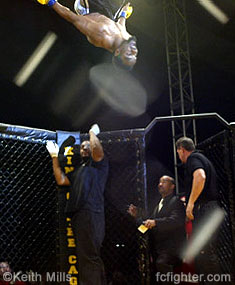 Charles 'Crazy Horse' Bennett does a post-fight backflip from the top of the cage