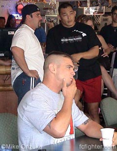 Teammates UFC's Phil Baroni and Enson Inoue talk shop while Tom Sauer concentrates on the weigh in