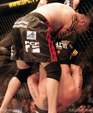 Frank Mir armbarring Tim Sylvia at UFC 48